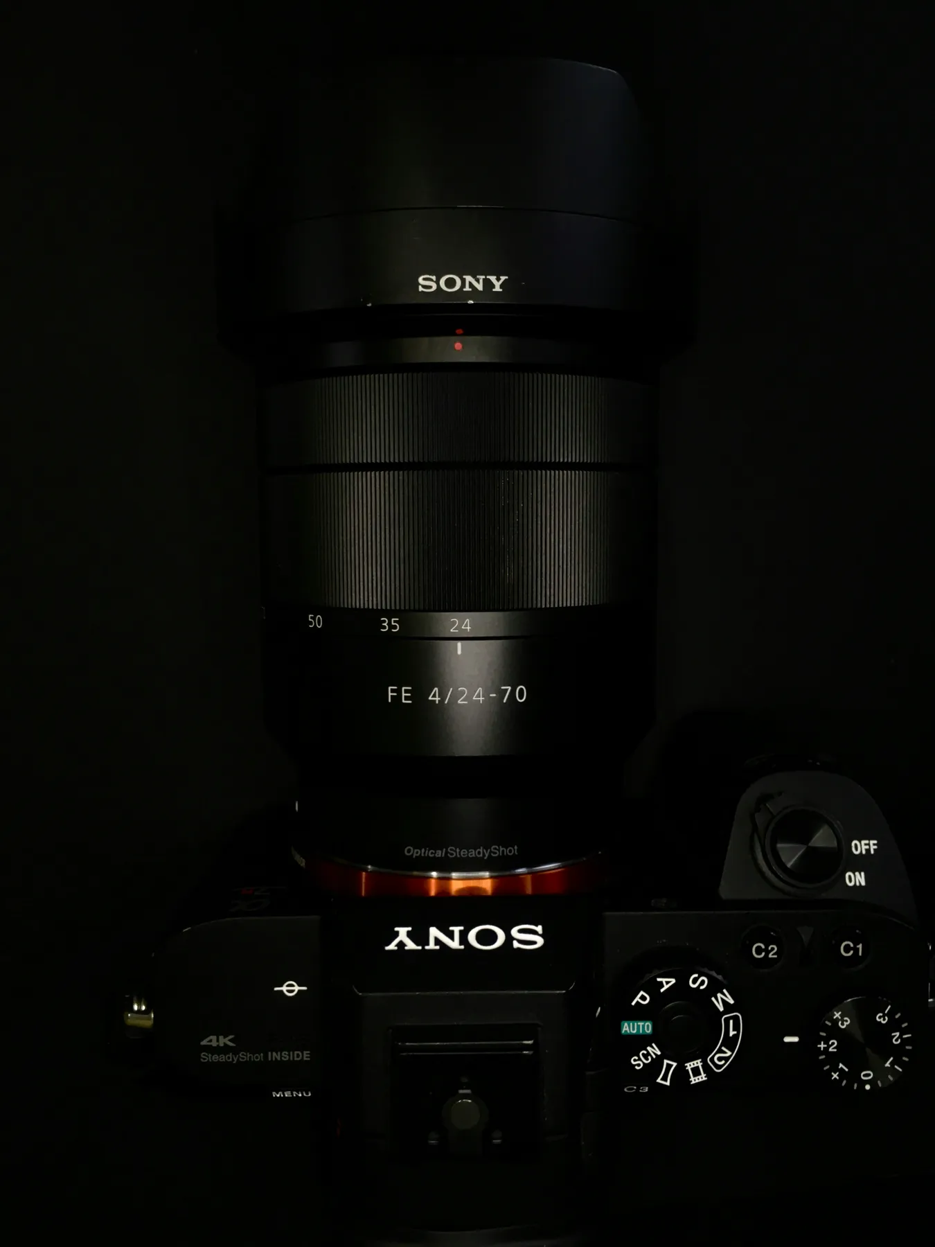 Top view of Sony A7 IV showing FE 24-70mm lens, mode dial and 4K SteadyShot badge